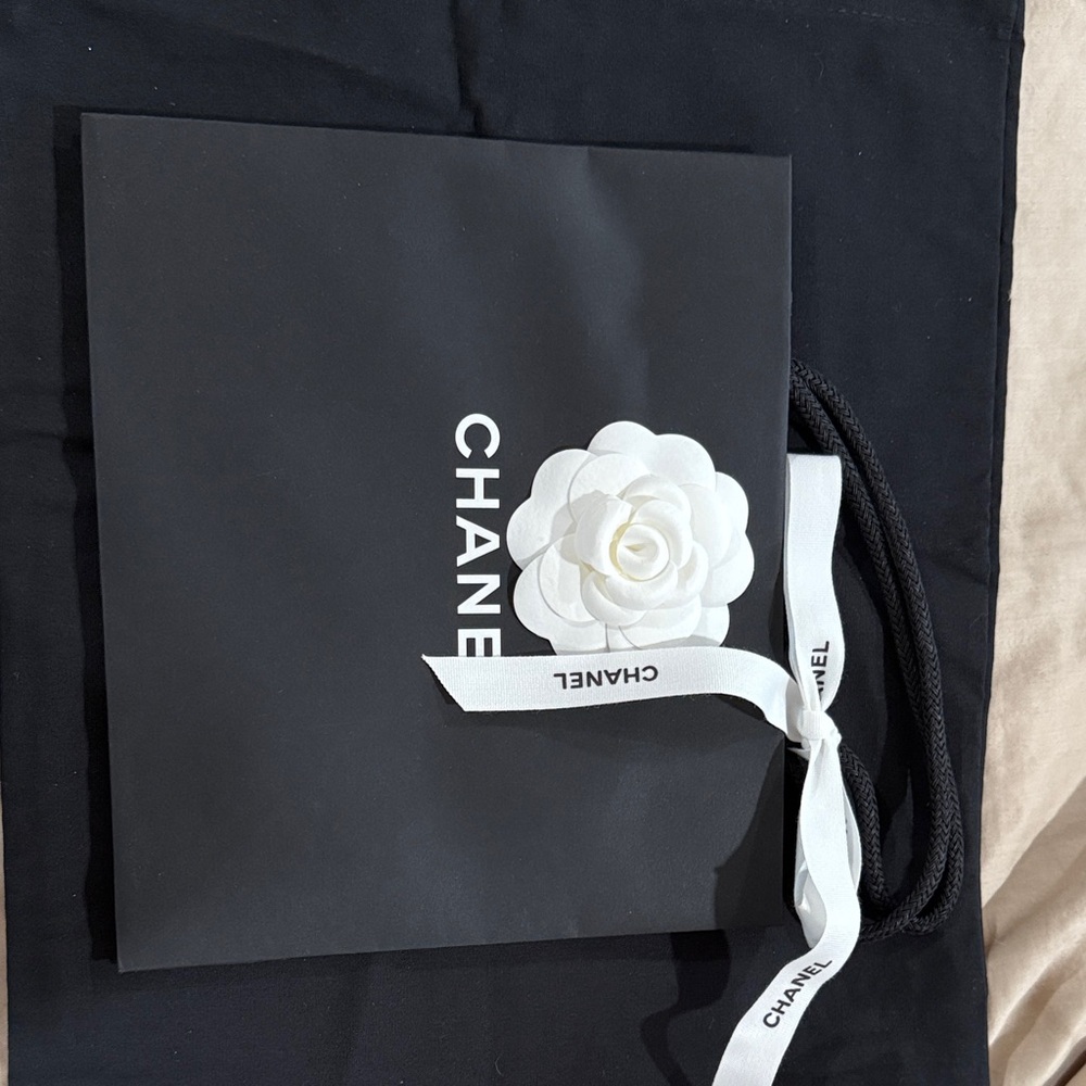 Chanel Black Bag with White Camellia